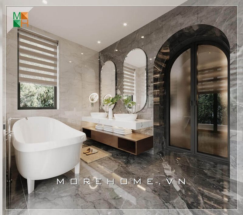 Sự sang trọng của không gian phòng tắm còn thể hiện ở đá lát sàn và ốp tường vân mây rất đẳng cấp.